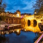 Night falls at Pulteney Bridge in Bath.
